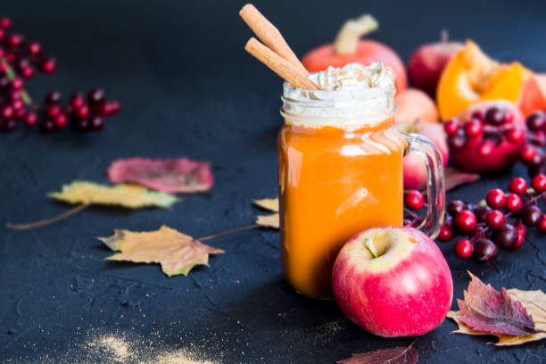istock Halloween cocktail, pumpkin orange drink with spices 2183561081