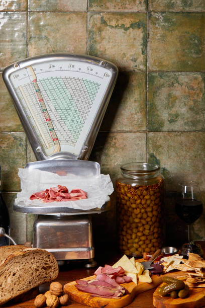 Delicatessen Foods Over Table With Antic Scale