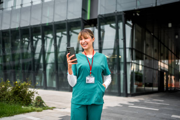 istock Female nurse using a mobile phone during a break 2183567630