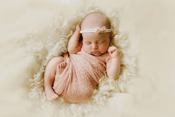 istock Newborn Baby Girl Sleeping 2183568477