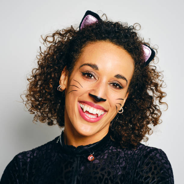 istock Woman With a Cat Costume 2183570019
