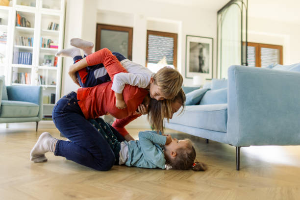 istock Mother and children playing together 2183577345