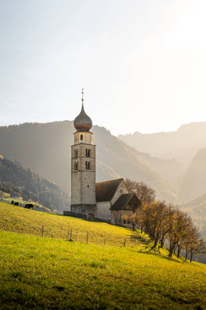 istock A typical church nestled in mountain meadow illuminated by a magical sunny light 2183587799