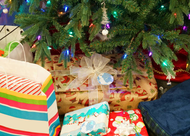 istock Close up on gift bags and boxes under Christmas tree 2183589197