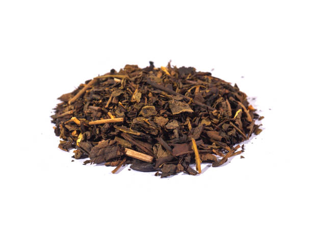 istock Dried tea leaves isolated on white background. Tea is a caffeinated beverage, an infusion made by steeping the dried leaves, leaf buds, or leaf stalks of the Camellia sinensis plant in hot water. 2183591872