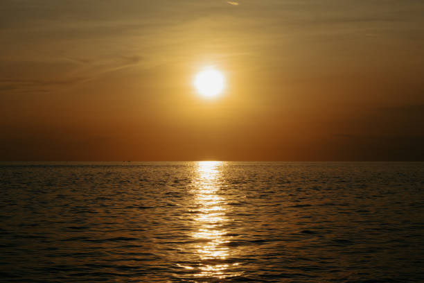 istock Sunset over the sea. The sun is reflected in the water. 2183595204