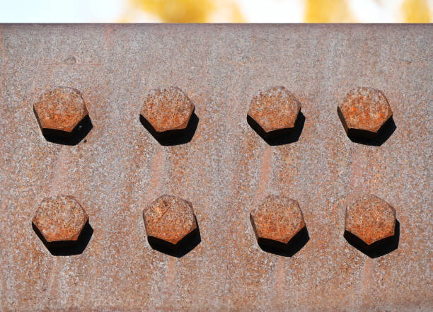 Closeup of bolts on a steel bridge.