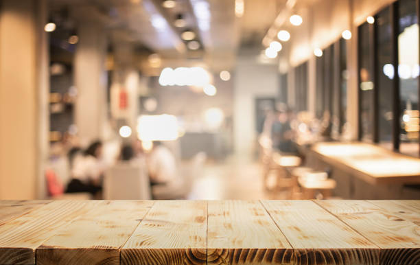 istock Counter top cafe bar,wood texture table with blur people sitting in modern working space.For decoration product display background 2183599088