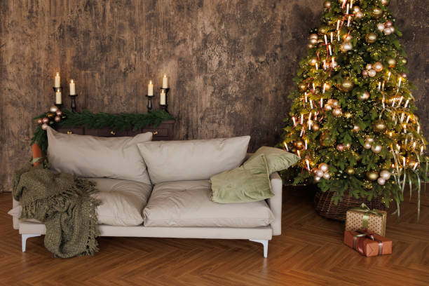 istock A cozy living room with a grey couch and a Christmas tree 2183599993