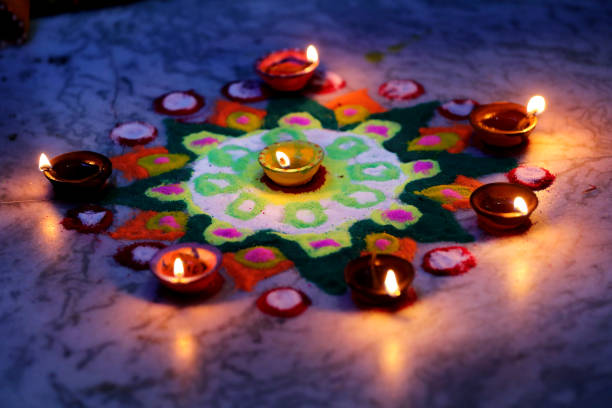 istock Diya placed on a vibrant rangoli 2183601970