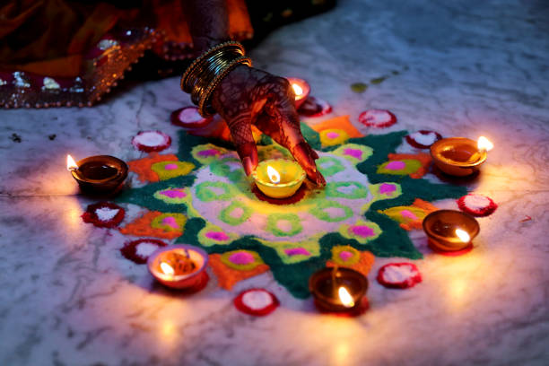 istock Diya placed on a vibrant rangoli 2183601973