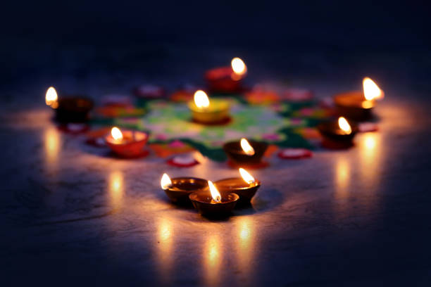 istock Diya placed on a vibrant rangoli 2183601978