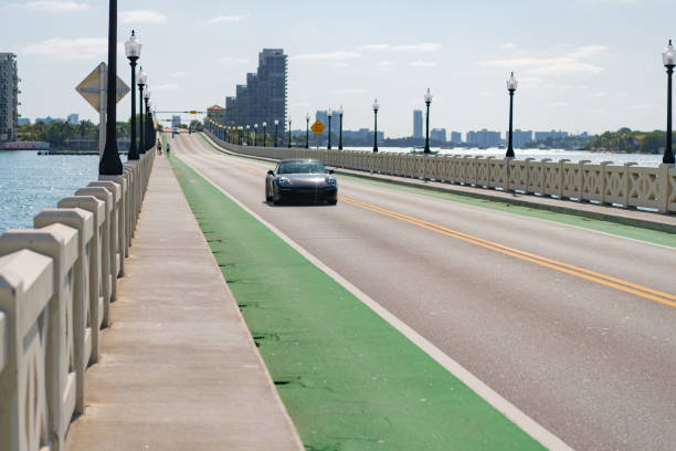 Miami, Florida USA - April 15, 2021: 2013 Porsche 911 Carrera car on the empty road.