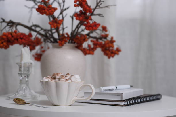 istock A Cozy Coffee Setup Featuring Beautiful Autumn Decor, Notebooks, and a Relaxing Atmosphere 2183605607