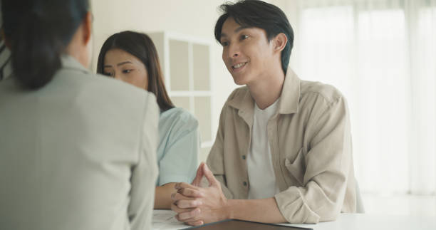 istock Couple Meeting With Financial Advisor in Modern Office. 2183606113