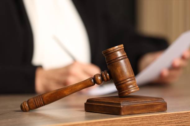 istock Judge working with document indoors, selective focus. Mallet on wooden table, closeup 2183608165