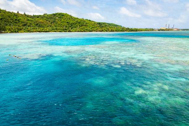 istock Pristine Turquoise Waters and Lush Green Island Under a Cloudy Sky, Guam 2183611485