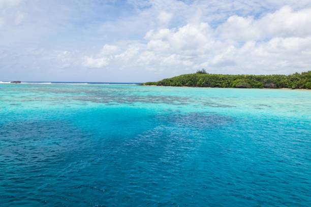 istock Pristine Turquoise Waters and Lush Green Island Under a Cloudy Sky, Guam 2183611503