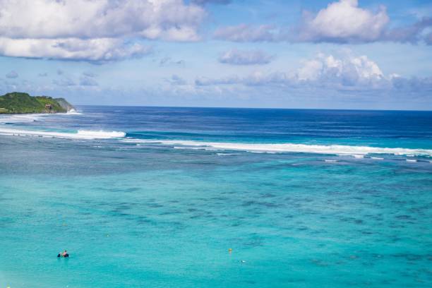 istock A Serene Seascape: Turquoise Waters Meet the Horizon Beneath a Cloudy Sky in Guam 2183612522