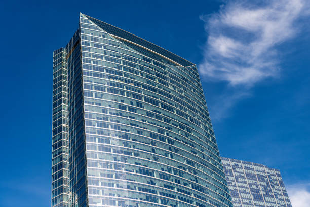 skyscraper building architecture. skyscraper with glassy facade. modern glass building. skyscraper in metropolis city. city downtown with skyscraper. office building metropolis architecture.