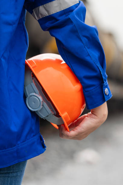 istock A worker holding orange safety helmet. Ready to work in challenge industrial. 2183613746