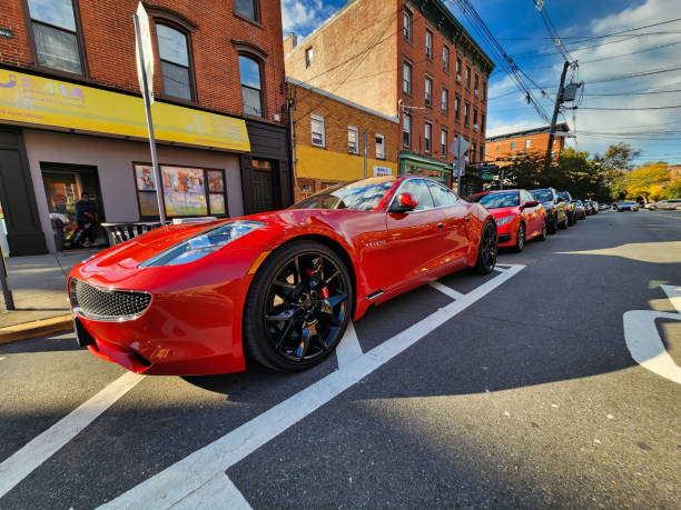 New York City, USA - October 24, 2023: Fisker Karma Revero red sport car, low angle view.