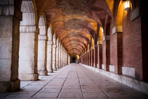 istock Historic Stone Archway with Warm Lighting 2183616237