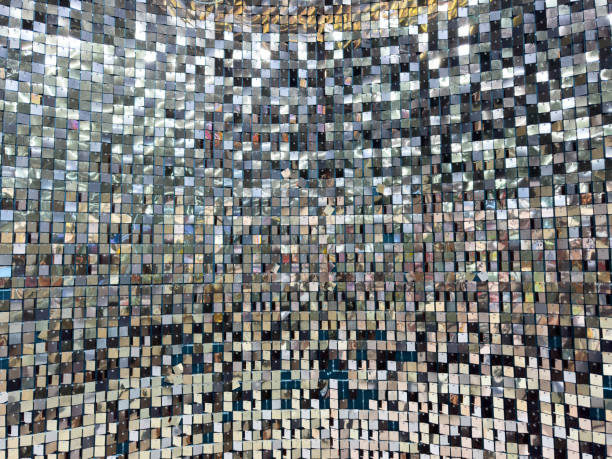 istock A wall of shiny silver tiles with a pattern of squares 2183619195