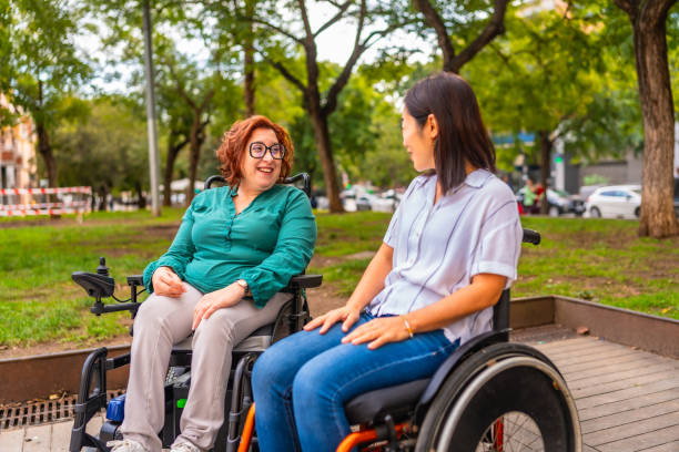 istock Multi-ethnic disabled women talking together in a city park 2183622154