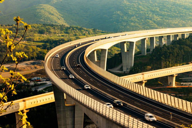 istock Sunset Traffic Flowing on Large Viaduct 2183626390