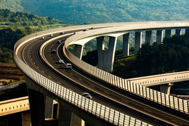 istock Sunset Traffic Flowing on Expansive Viaduct 2183626393