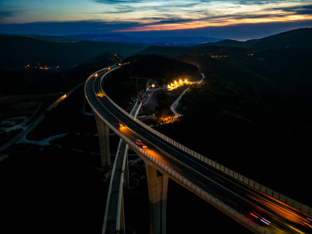 istock Nighttime Traffic Flowing on Sprawling Viaduct 2183626471