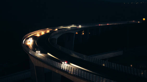 istock Illuminated Nighttime Traffic Flowing on Majestic Viaduct 2183626486