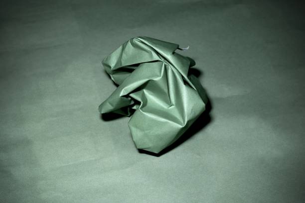 Close-up of origami abstract wind rose paper figure against black background. Photo taken February 14th, 2025, Zurich, Switzerland.