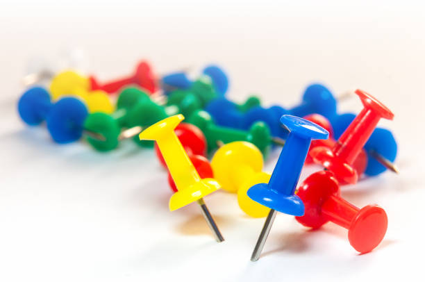 push pins on the white background