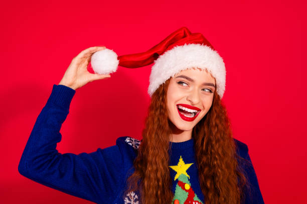 istock Photo of shiny attractive lady dressed ornament pullover headwear enjoying x-mas day empty space isolated red color background 2183636745