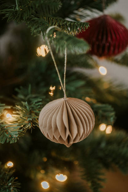 istock Christmas ornament bauble close up hanging in tree low key 2183638493