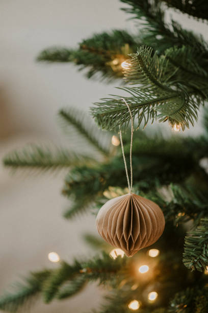 istock Christmas ornament bauble close up hanging in tree low key 2183638516