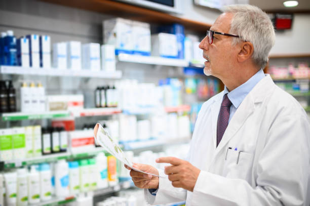 istock Senior pharmacist checking medicine inventory in pharmacy 2183640315
