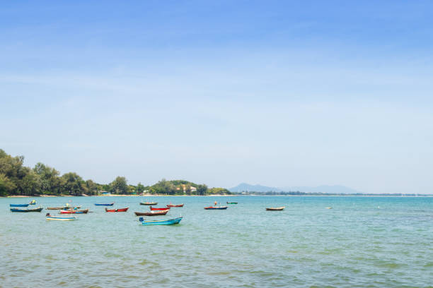 istock small boat moored at seaside in Thailand 2183644095