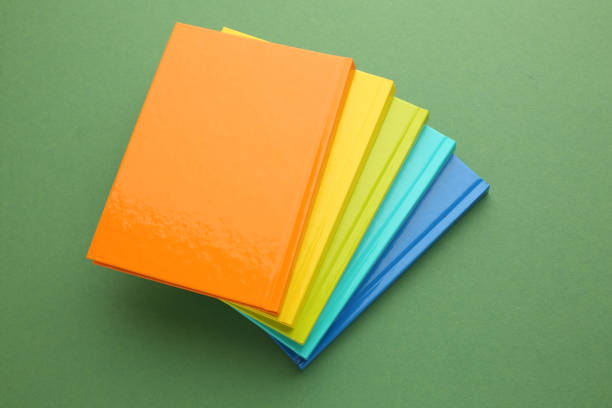 Stationery calculator ruler calculator and school cheat sheets on coloured background. Concept of school and college learning. High quality photo