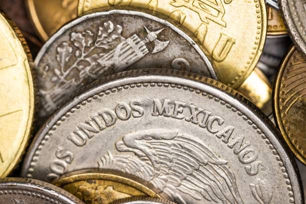 istock Close-up of Mexican coins with intricate designs. 2183645202