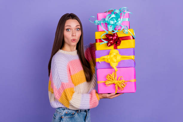 istock Portrait of impressed nice person hands hold pile stack giftbox pouted lips isolated on purple color background 2183645301