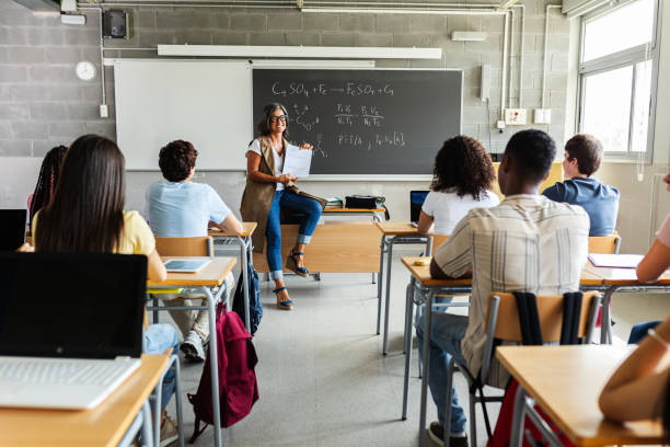 istock Young group of gen z students attending teacher in class at high school. 2183645904