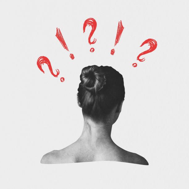 istock Woman in Contemplation With Question Marks 2183646094