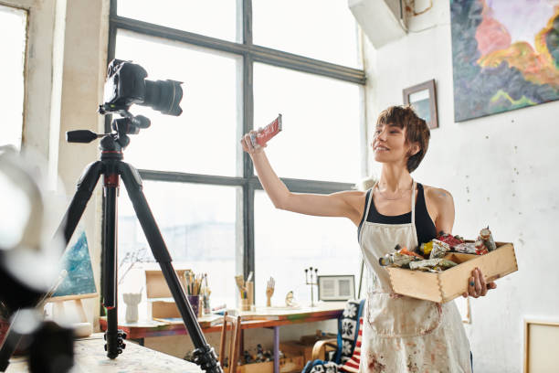 istock Young woman artist shares her creative process in a bright studio with natural light 2183646689
