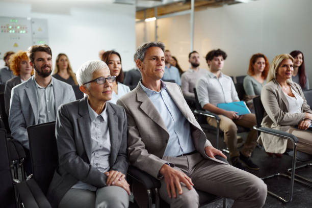 istock Business people attending a seminar in board room. 2183647513