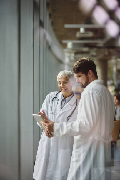 istock Medical experts working on touchpad in a hospital. 2183647788