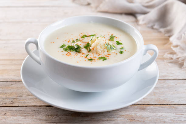 istock Cauliflower soup in bowl on wooden table 2183649088