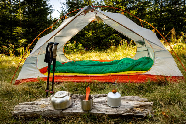 istock Camping with a tent and cooking equipment in the mountains. 2183649128